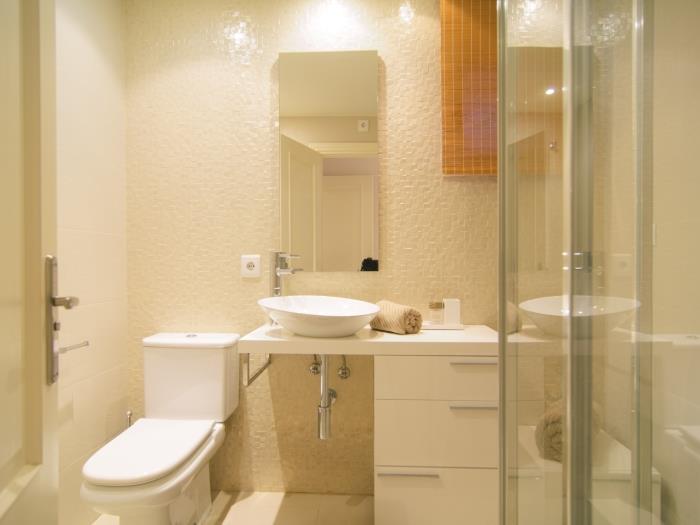 Ensuite bathroom with glass shower cabin, sink