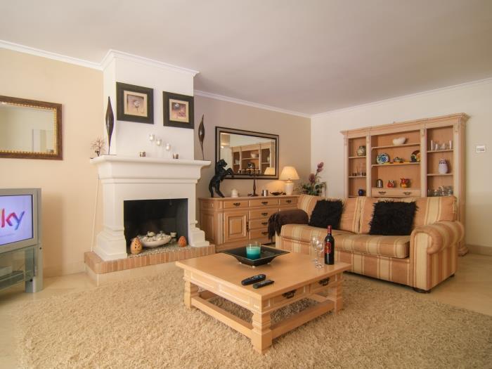 Coffee table in front of fireplace in living room