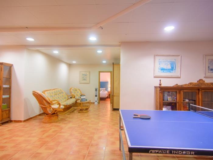 Spacious game room with ping pong table