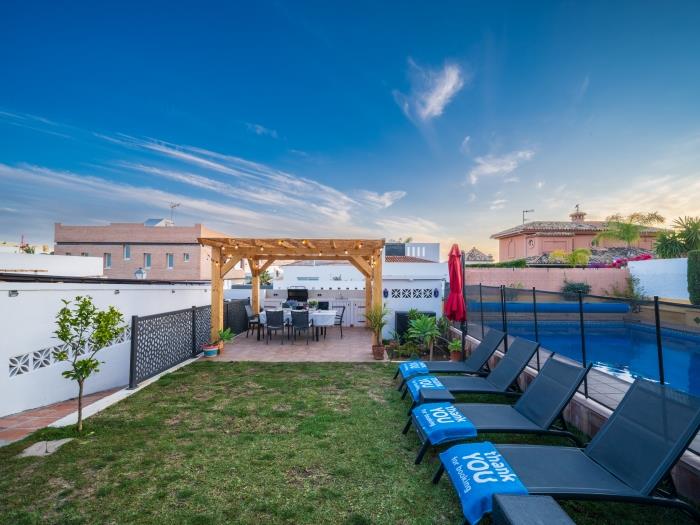 Sun loungers by the pool, ping pong table, BBQ area with dining table, terrace with sitting and dini