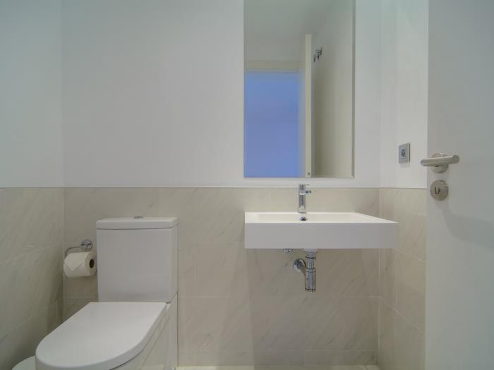 Service toilet with sink and mirror