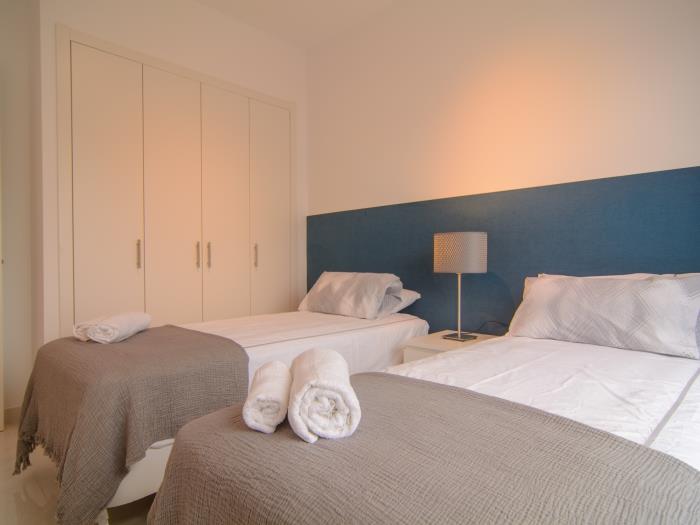 Spacious wardrobes and two single beds