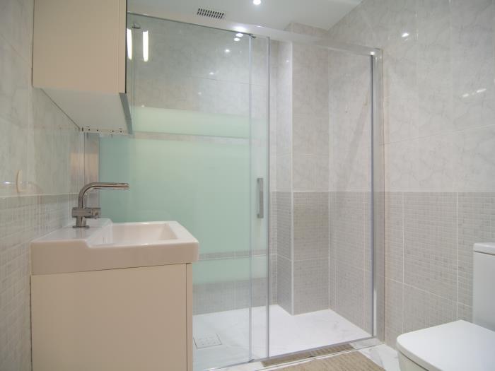 Family bathroom with walk in shower, sink, toilet