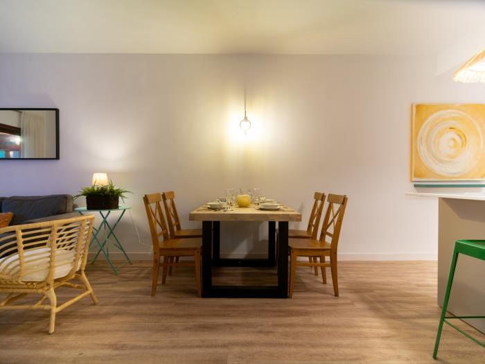 Dining area with wooden table and chairs for 4