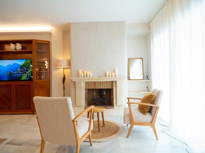 Fireplace with two comfortable armchairs in a homey atmosphere