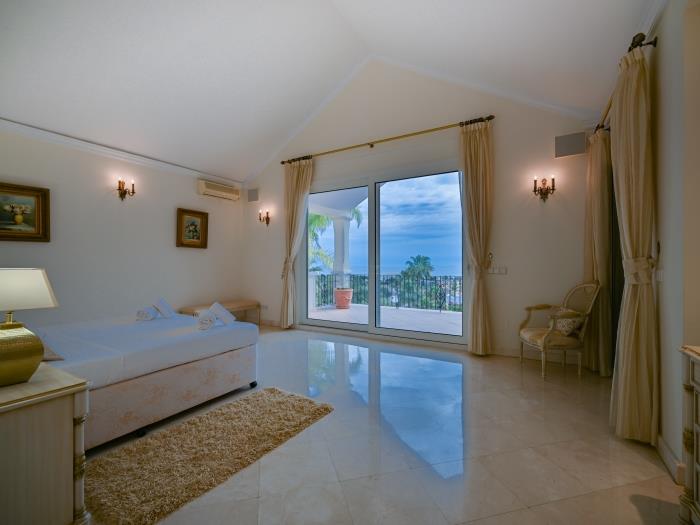 From the master bedroom, you may exit to the lovely terrace with panoramic views