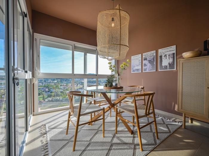Glass round table for 4 in a corner of the spacious living room with panoramic views