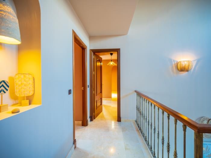 Elegant staircase that leads to the first level of the villa