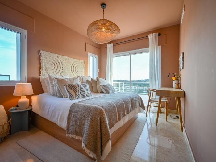Bedroom with a double bed and working place