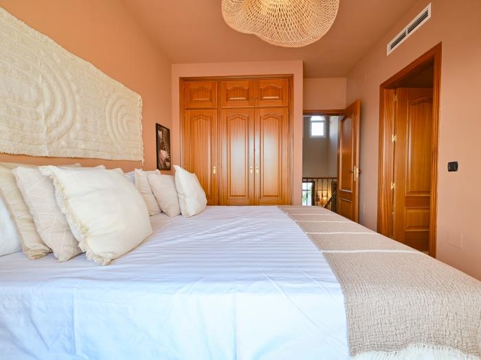 Bedroom with recessed wardrobes, double bed, en suite bathroom