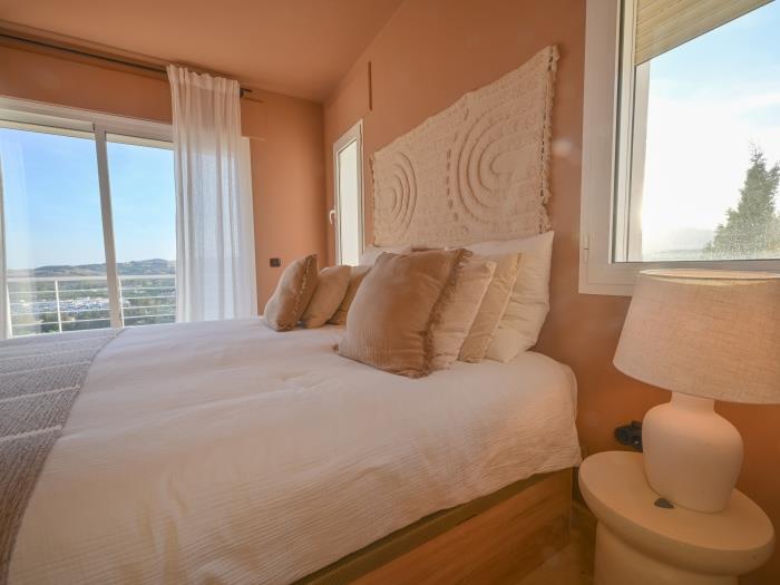 Bedroom with exit to terrace offering beautiful mountain views