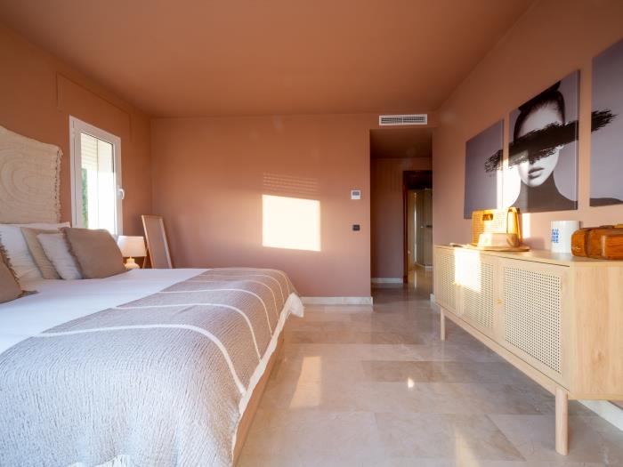 Double bed in bedroom with exit to spacious terrace