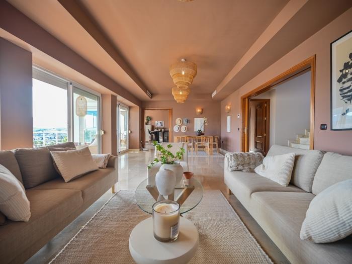 Spacious living room with exit to terrace and garden