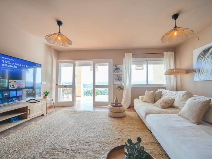 Spacious living room with exit to terrace and pool