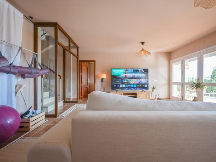 Living room with TV and comfortable sofa