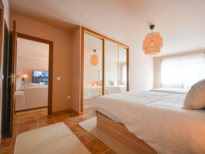 Bedroom with recessed wardrobe and en suite bathroom