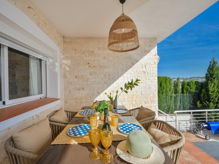 Terrace with dining area for 6 and access to pool and sunloungers