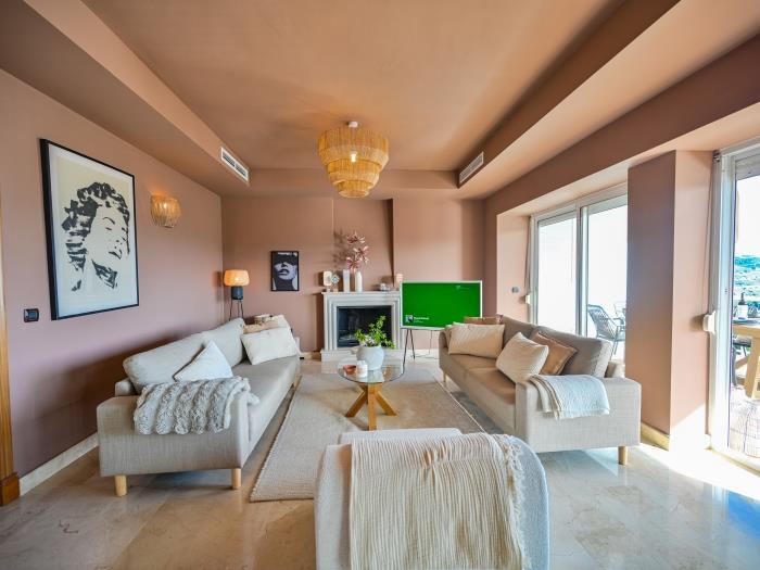 Lounge area with garden views, fireplace and TV