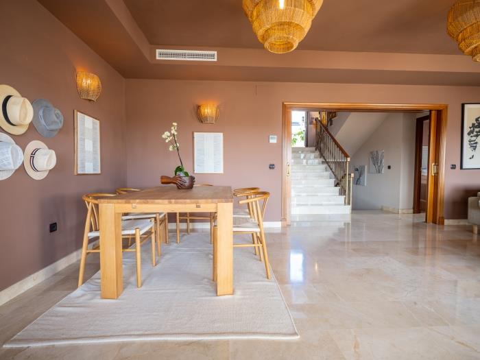 Dining area in spacious living room with open plan kitchen