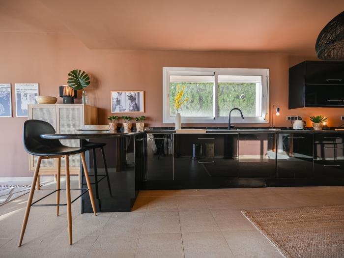 Open plan kitchen with barstool and all equippment included